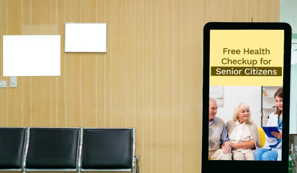 hospital digital signage displaying information about free medical checkup as a part of marketing strategy