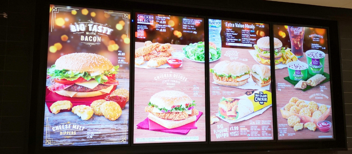Video wall at a restaurant showing the food items, descriptions and price