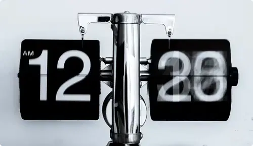 clock showing time in digital format used to plan content scheduling on digital screens