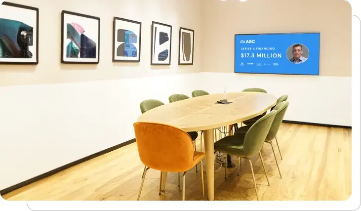 An office digital signage screen showing financing info