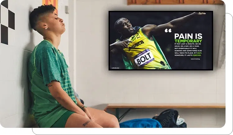 Digital signage screen showing internal updates and team communications at stadium