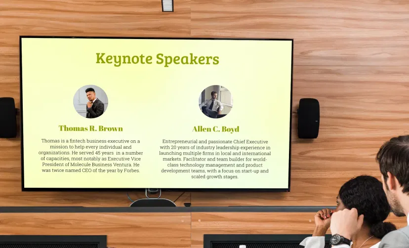 People Space App showing keynote speaker's information on the digital signage screen at a meeting room People Space App showing keynote speaker's information on the digital signage screen at a meeting room