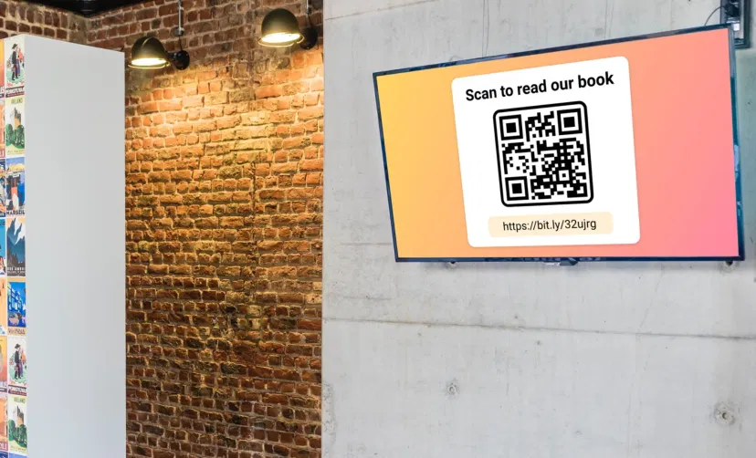 Digital signage screen placed in school library showing QR code using Pickcel software to read digital copy of a book Digital signage screen placed in school library showing QR code using Pickcel software to read digital copy of a book