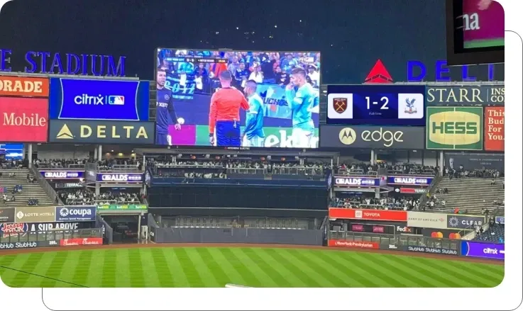 Digital signage screen showing fan experience features and real-time game updates at stadium Digital signage screen showing fan experience features and real-time game updates at stadium