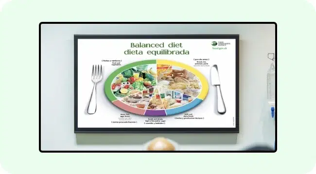 A digital signage screen showing multilingual health information A digital signage screen showing multilingual health information