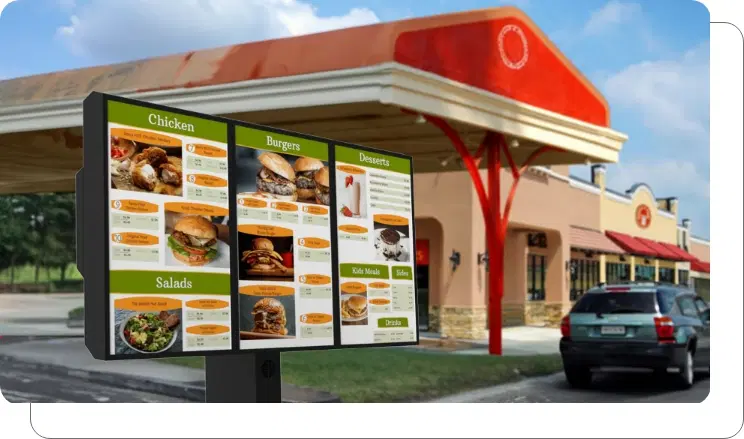 Drive-thru menu design A drive thru digital menu board visible from a distance