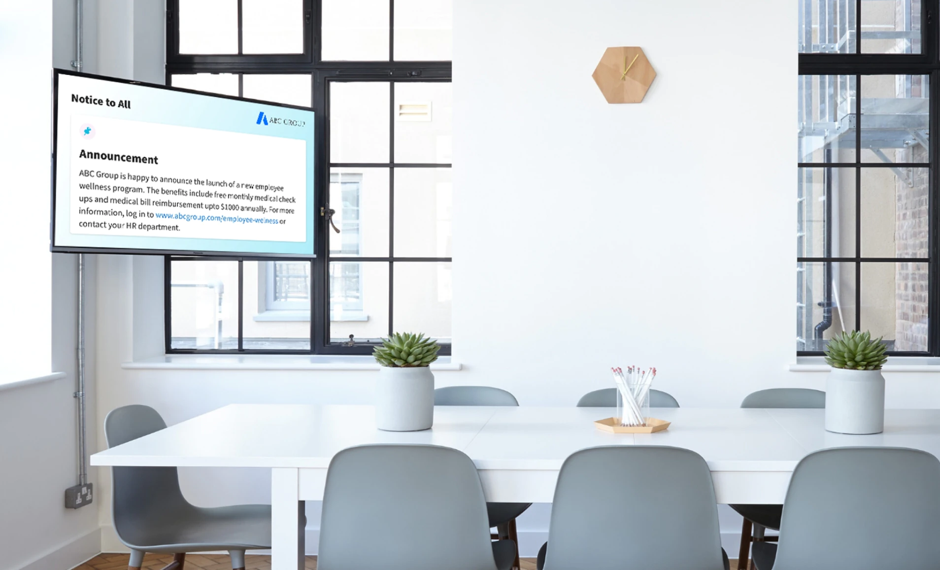 Digital signage screen placed at office meeting room showing bulletin board notice using Pickcel software