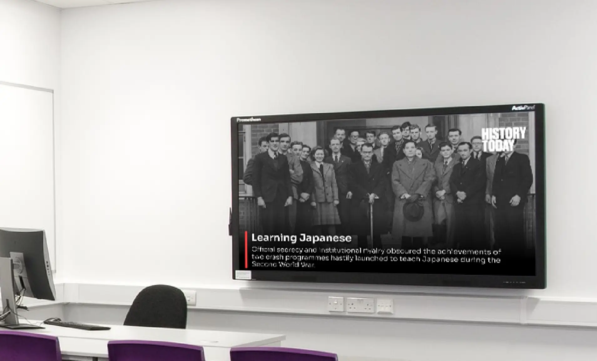 classroom digital signage displaying news feeds from History Today News digital signage app