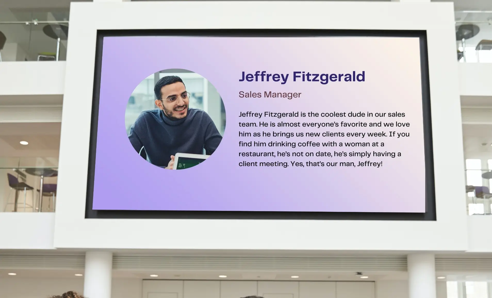 digital signage at the entrace of a meeting room displaying team profiles from Meet Your Team app