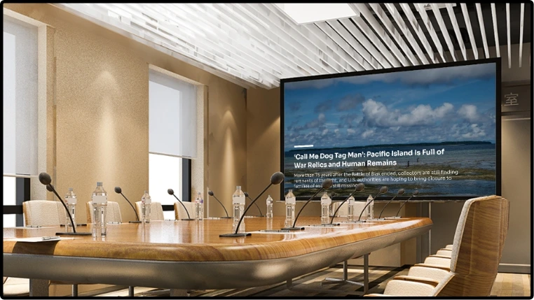 digital signage screen at meeting room showing feeds from NYtimes News app with news topic image as background and news text placed at the bottom
