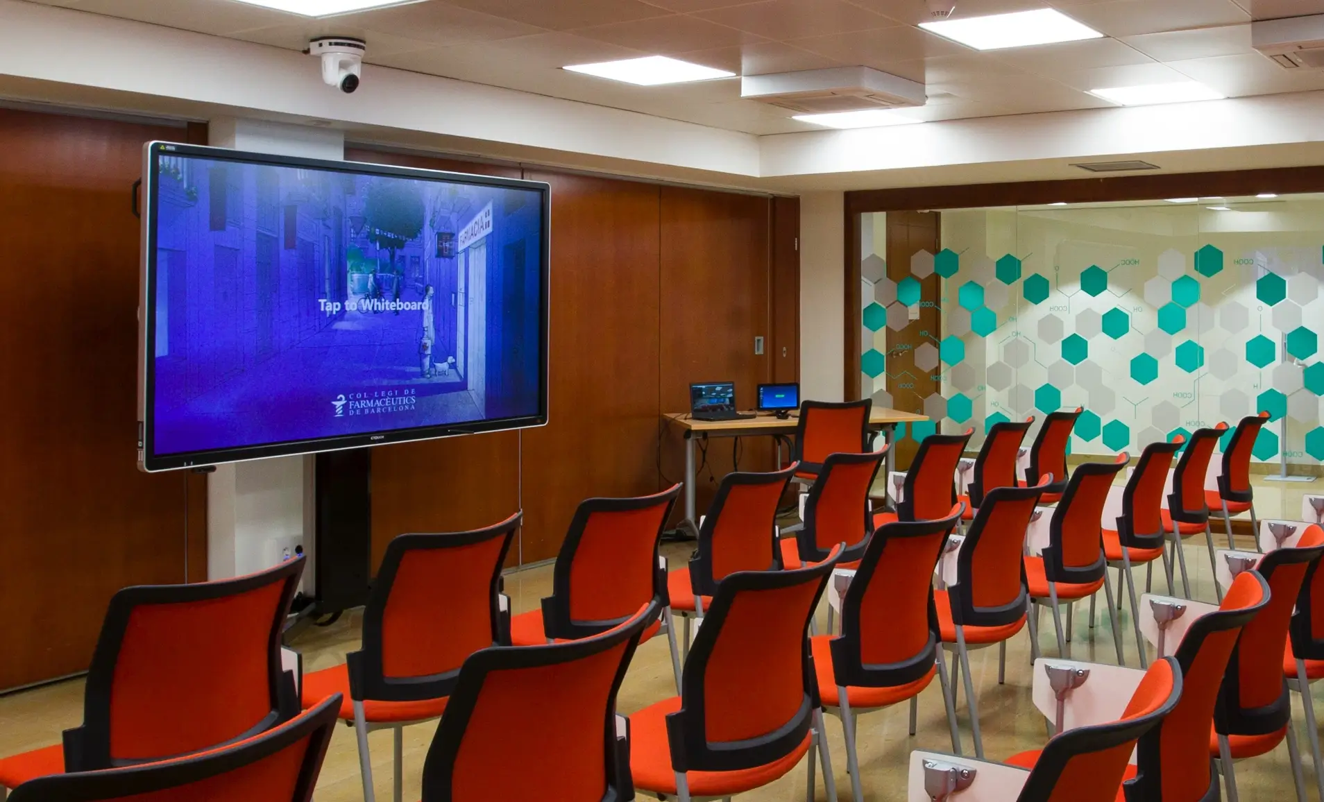 Digital Signage on a community hall wall displaying RSS feeds from a website using Pickcel's RSS feed app.