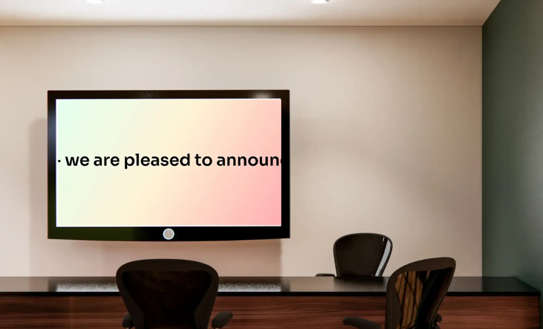 digital signage screen in a meeting room dispaying scrolling text about an important company announcement.