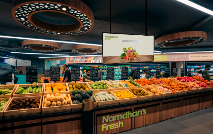 Asian paints customer choosing paint color in interactive digital signage display placed in-store powered by Pickcel's custom digital signage software