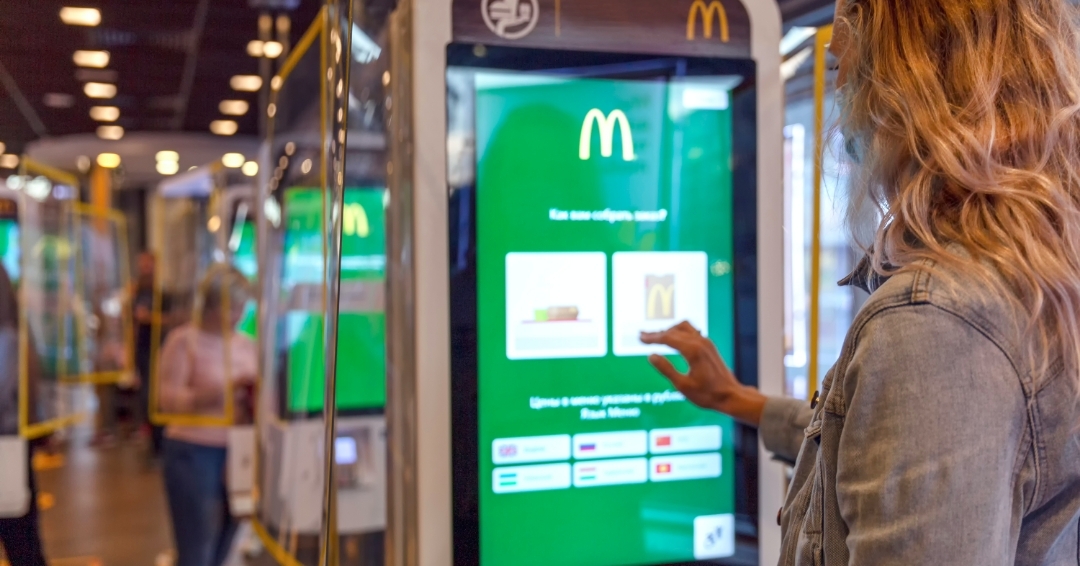 interactive digital signage at Mc donald's used as digital menu board to book orders