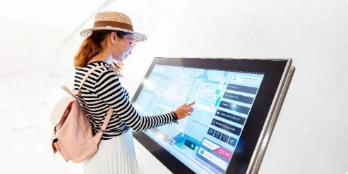 Interactive kiosk displays in hotel reception area used for visitors to interact with get information