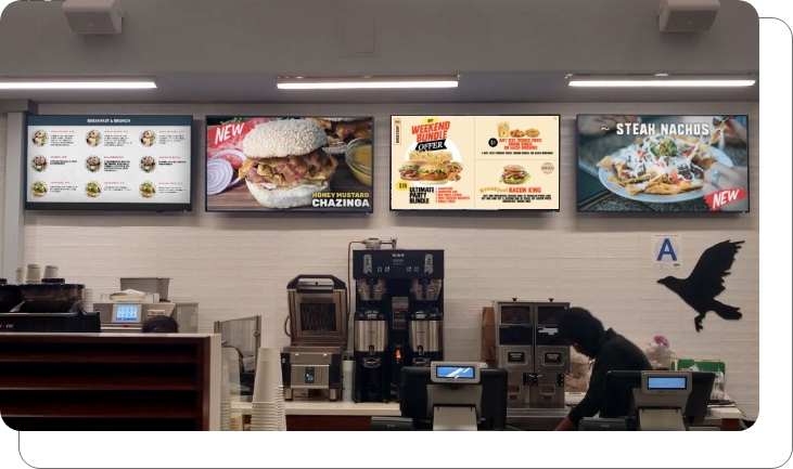 A digital menu board for a coffee shop running menu and ads simultaneousl