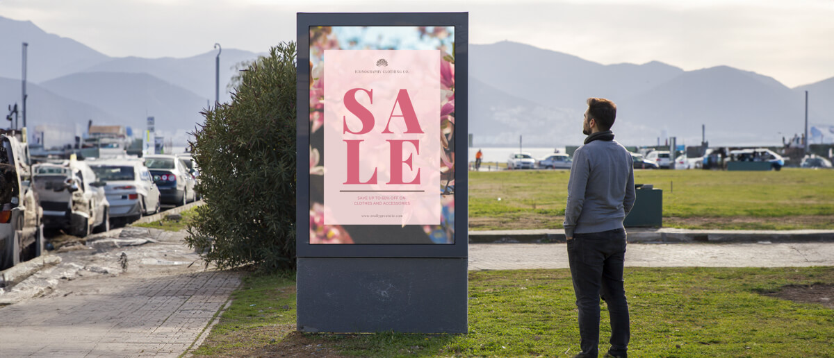 Digital signage promoting sale outdoors