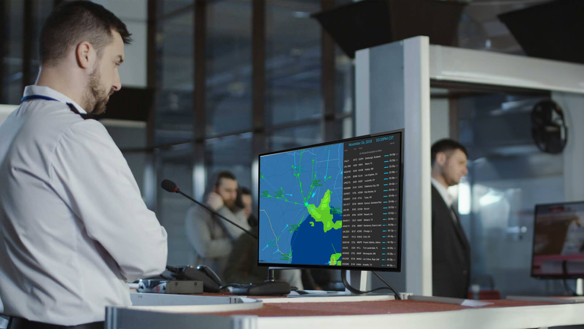  An airport official vieweing a digital screen showing the airport floor map