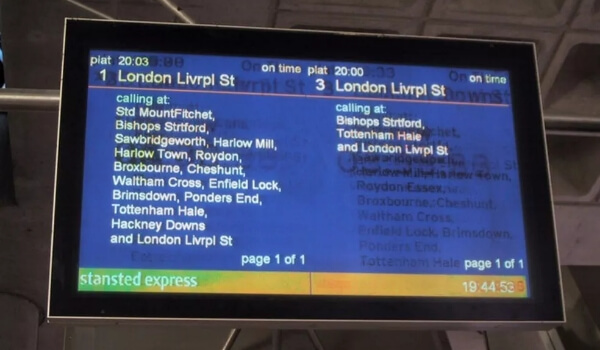 A commercial digital signage display showing train timings for London's Liverpool station