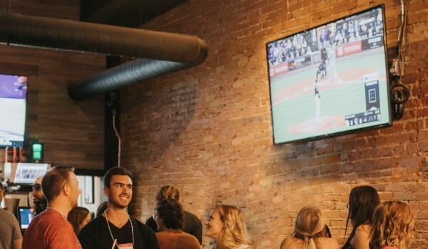 Image showing people watching a regular tv screen