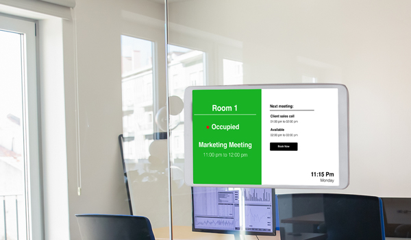 A tablet-sized electronic meeting room door sign shows the meeting agenda and meeting duration