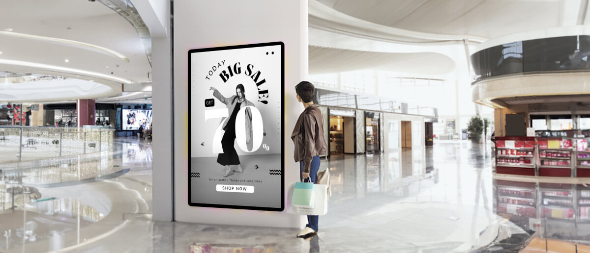 Woman looking at digital signage at a retail store