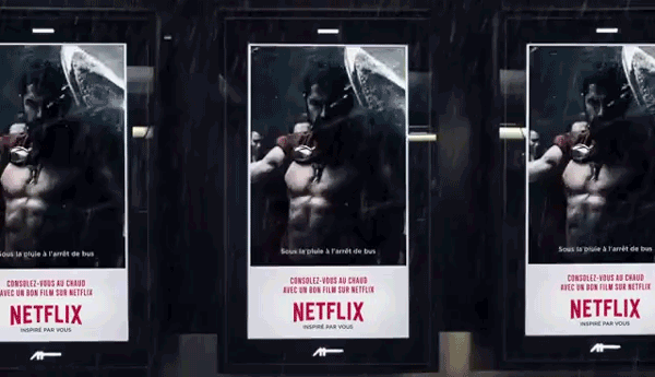 A series of DOOH screens show a digital poster of Gerald Bultler in the movie 300 with a Netflix CTA