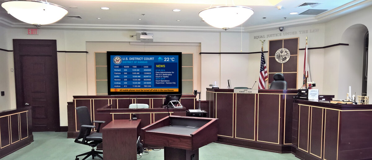 Courtroom digital signage being used in a court hearing.
