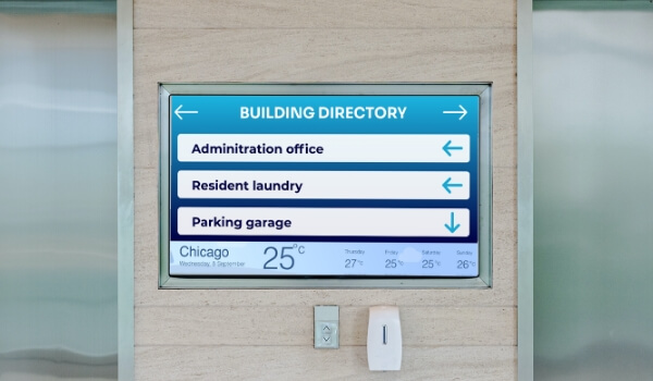 An office lobby directory shows office directions along with live weather updates