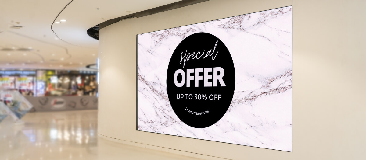 A digital reader board displaying a special 30% discount offer on products