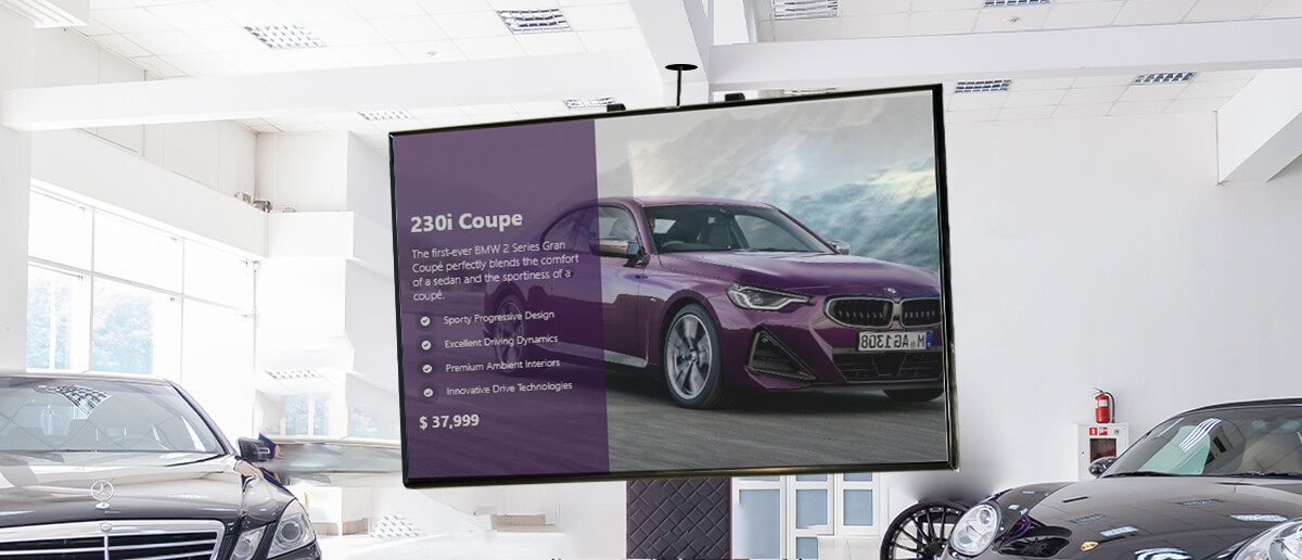 digital signage screen at a car dealership displaying car's features and pricing information