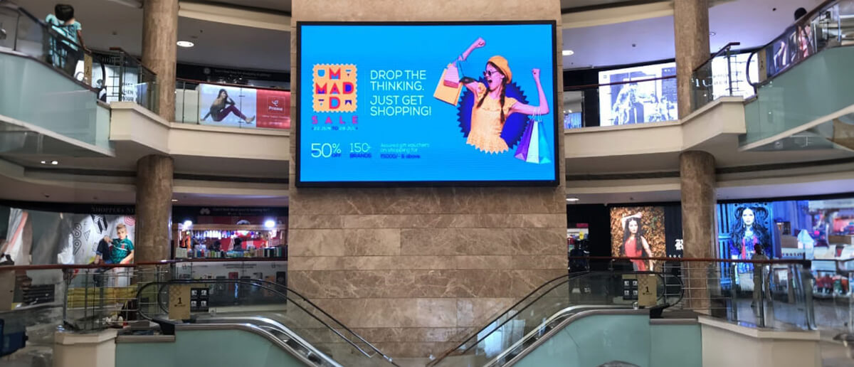 A digital signage screen showing content at a shopping mall