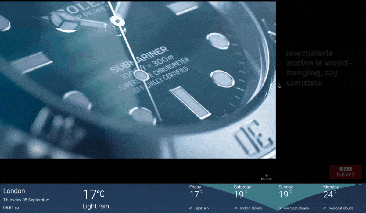A 3-zoned digital signage layout shows a video ad playing in one zone, BBC news feeds & live weather updates