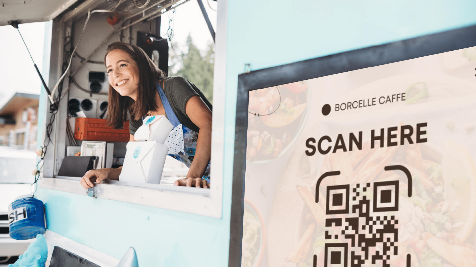 A woman working at a QR code enabled food truck