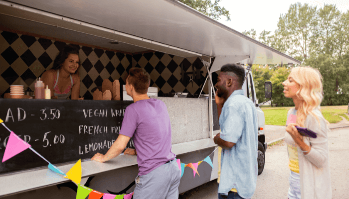 Customers queuing up before a food-truck to order