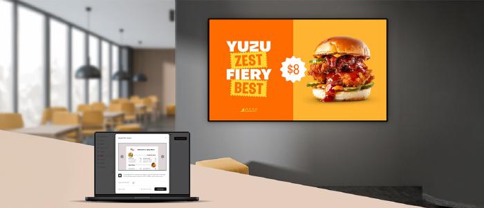 Free digital menu board software displayed on a restaurant counter screen