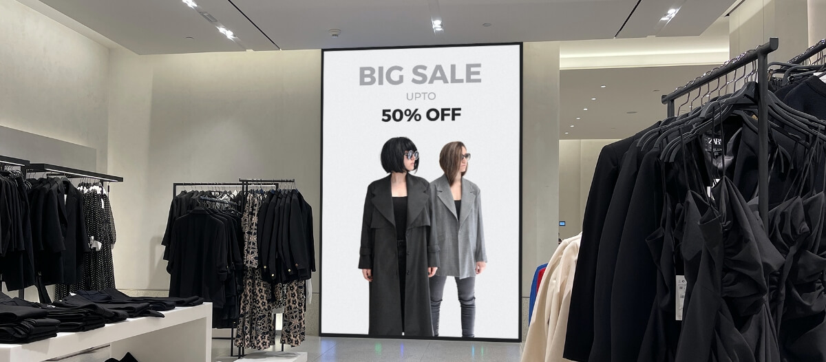 In-store retail digital signage displaying discount offer on garments