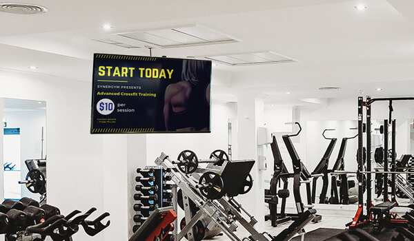 Gym TV screen informing clients about the prices of Advanced Crossfit sessions