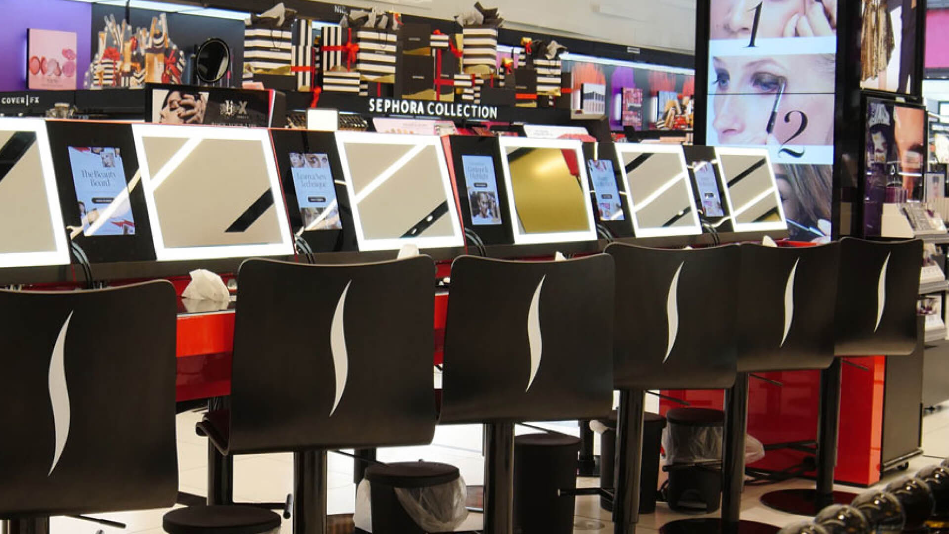 Sephora using interactive touchscreens to showcase detailed product info, view tutorials, and virtually try cosmetics.