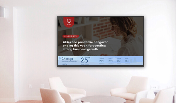 A corporate office waiting space shows live weather data & daily news updates on a digital signage screen
