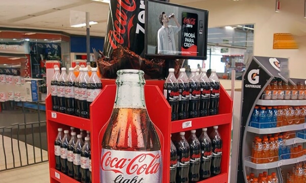 pop placed on beverage display rack in a general store