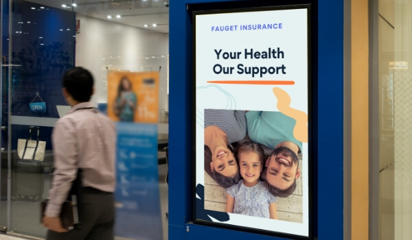 Bank digital signage used as a tool to promote insurance policies with catchy headlines and images