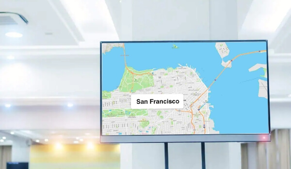 A digital signage screen shows San Francisco's traffic in real time using Google Maps