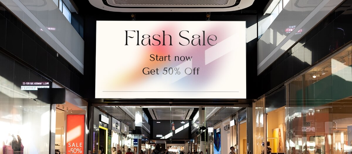 Flash sale offer of 50% discount shown on a shopping mall digital signage