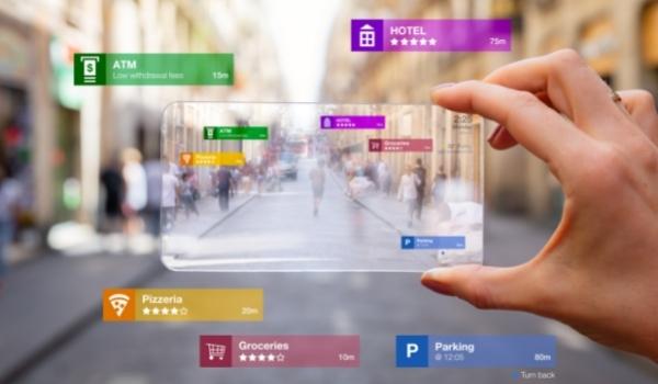 An Augmented Reality device demonstrates 3D wayfinding with labels on map like hotel, parking, etc.