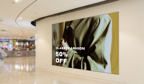 A Storefront display embedded inside a wall shows the product promotion of a retail brand