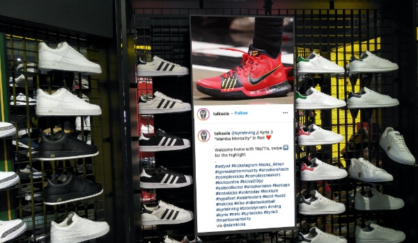 a shoe store displaying tweets and comments from their official twitter account on digital signage screen
