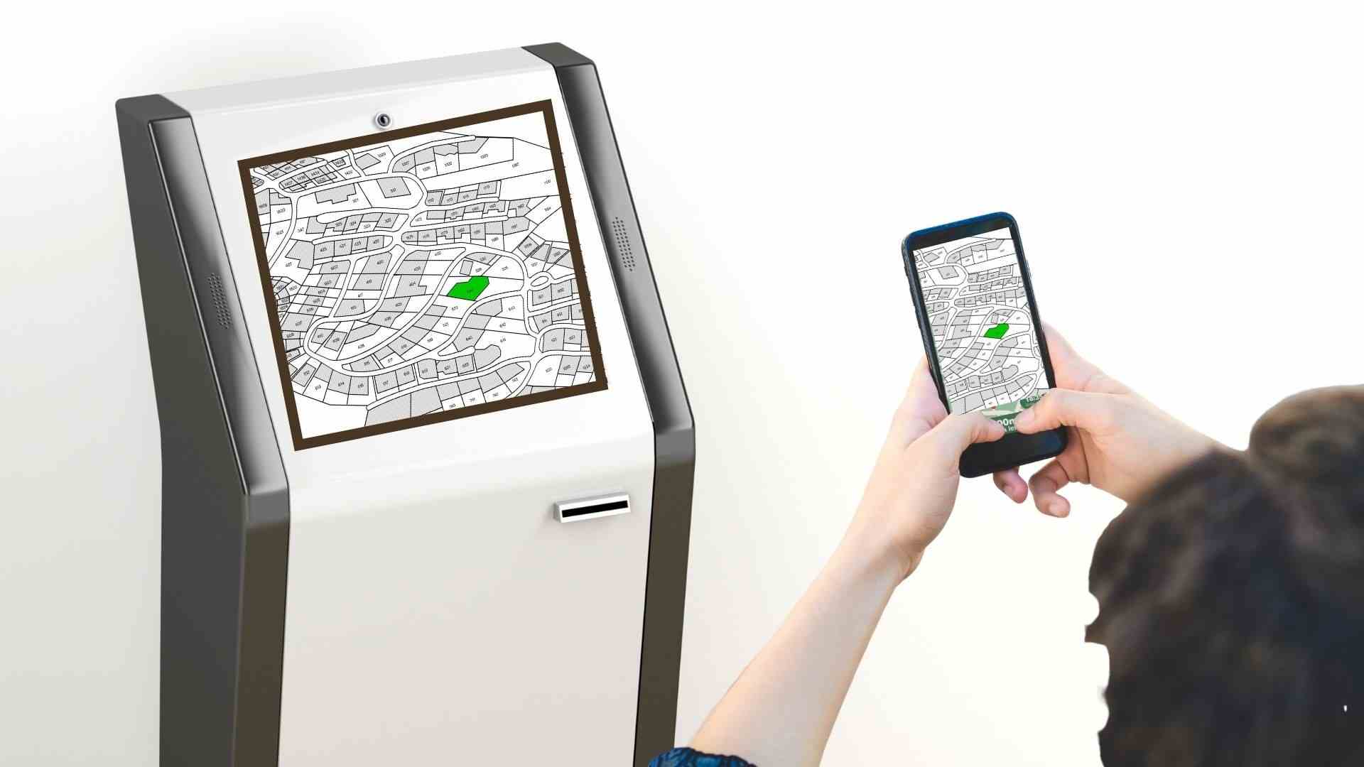 man scaning kiosk from mobile phone to get way finding map