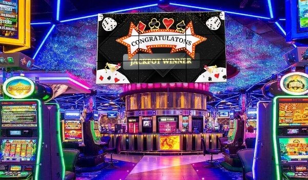   A large video wall announces a jackpot winner inside a casino