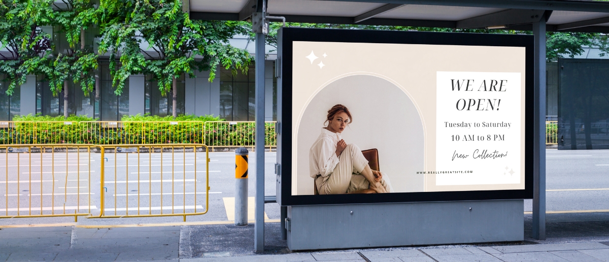 A bus-stop digital signage shows an advertisement